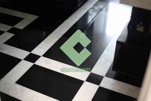 polished_black_marble_tiles_with_white_stripes_in_a_floor_pattern